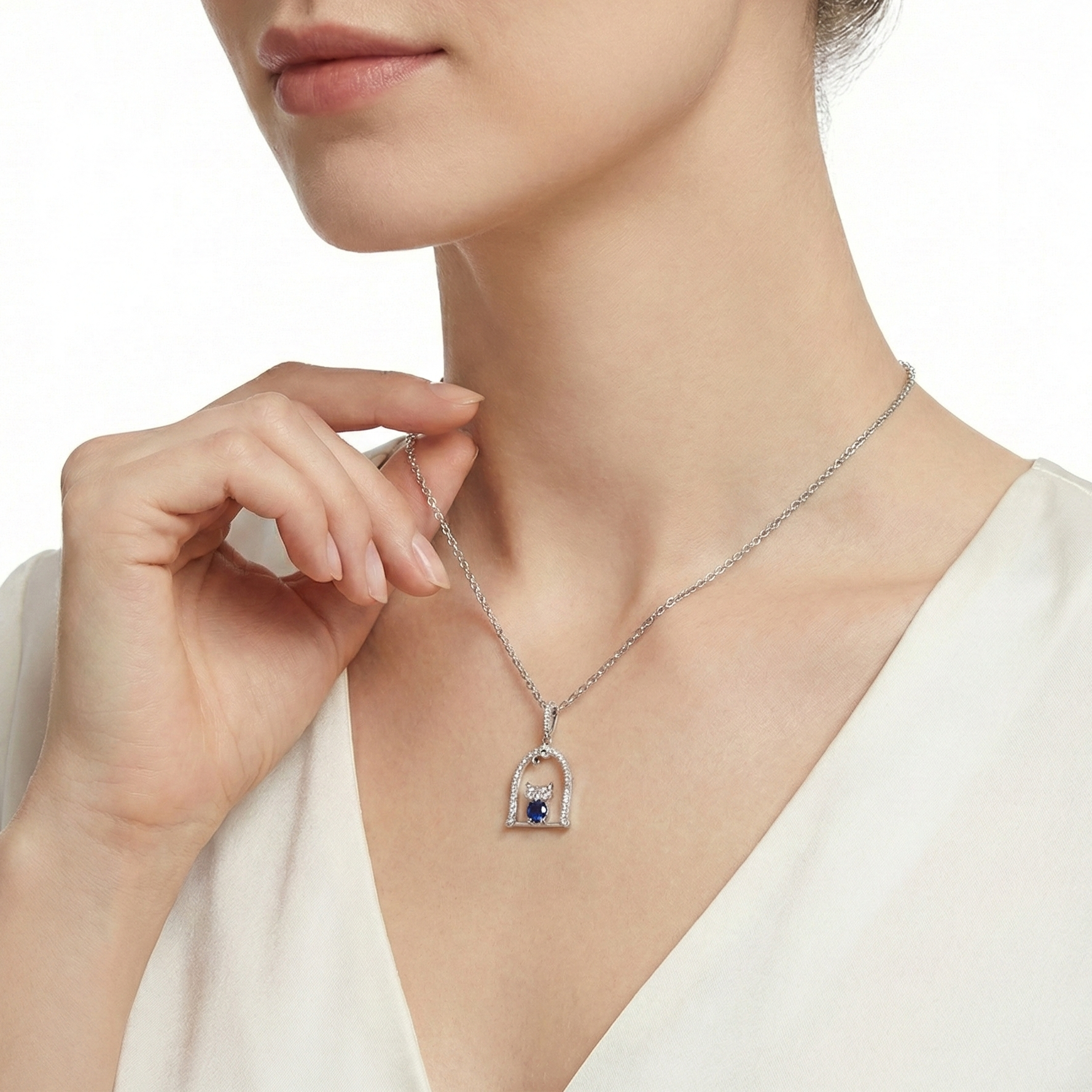 18KT White Gold Nestle Bird-in-Nest Pendant with Sapphire & Diamonds